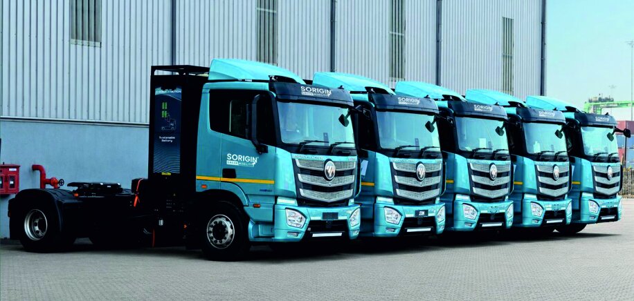 A row of Sorigin electric tractors parked side by side
